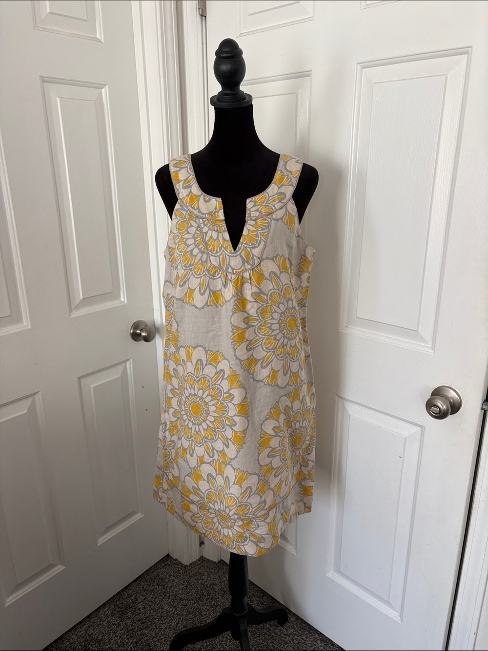 LOFT sleeveless linen shift dress featuring a bright floral print.
